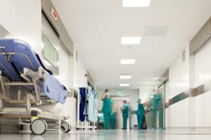 Hospital surgery corridor Blurred figures of people with medical uniforms in hospital corridor