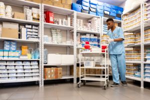 African American nurse organizing medical supplies at the hospital laboratory - healthcare and medicine concepts